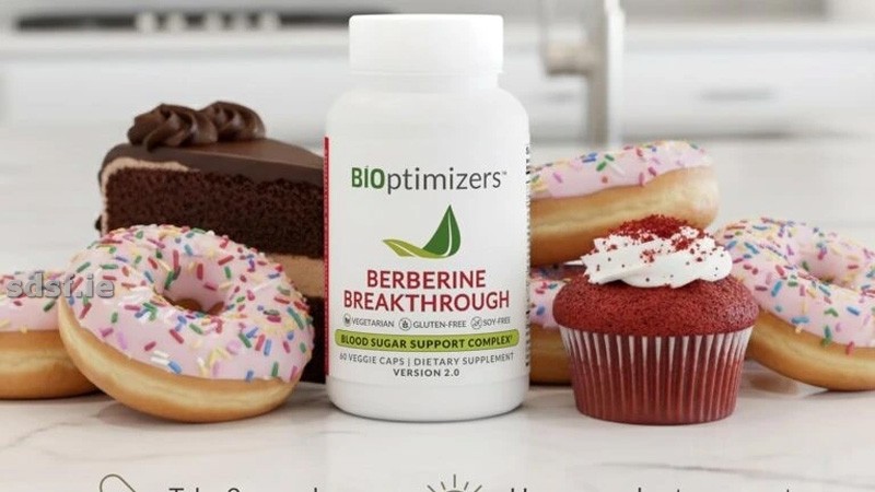 Person holding Berberine Breakthrough supplement bottle